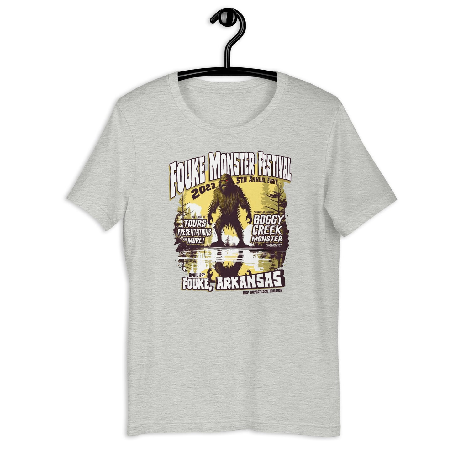 Get your hands on a one-of-a-kind Fouke Monster Festival t-shirt! Our original design t-shirt features the infamous Boggy Creek Monster and is perfect for fans of all things cryptid. Show your love for all things weird with our cryptid clothing and apparel.