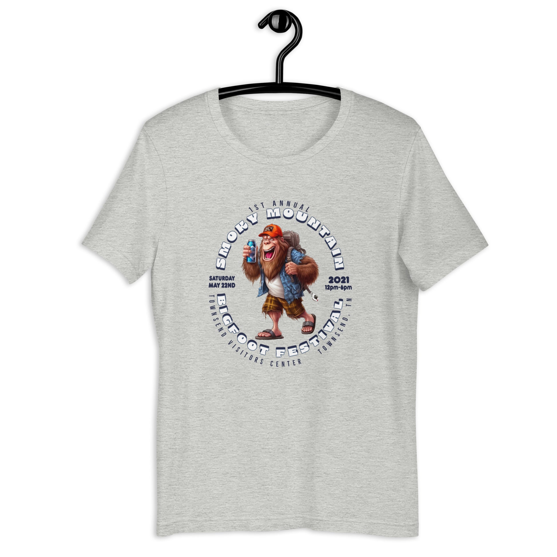"Get your hands on our exclusive Smoky Mountain Bigfoot Festival 2021 t-shirt! Featuring a cool cryptid design, this bigfoot t-shirt is perfect for any bigfoot enthusiast. Show off your love for the infamous creature with our limited edition bigfoot clothing. Shop now and add this must-have bigfoot apparel to your collection!"