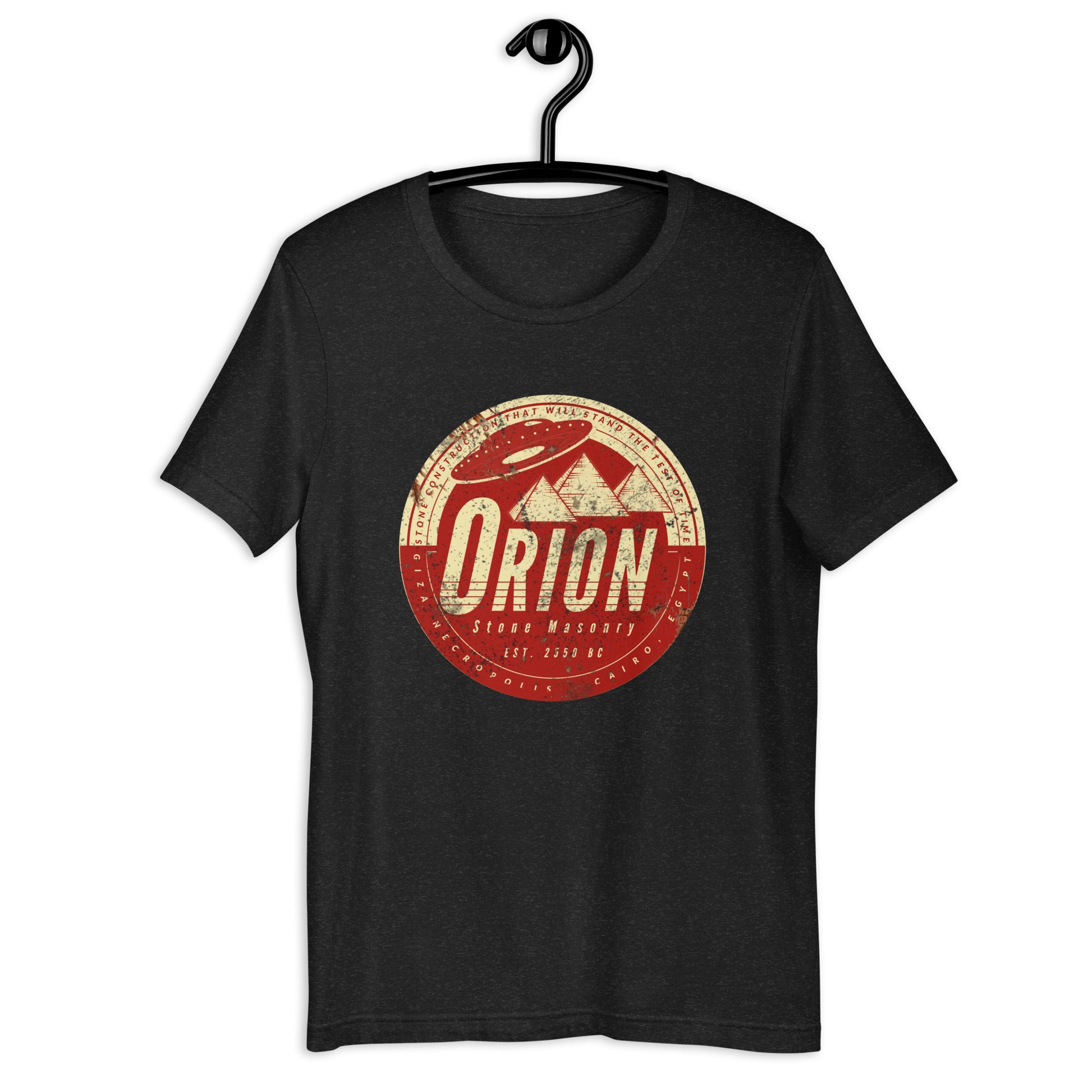 Looking for something out of this world? Look no further than Orion Stone Masonry's Egyptian t-shirt featuring a UFO hovering over a pyramid! Our high-quality, soft cotton t-shirt is the ultimate UFO apparel for anyone who dreams about space. Shop now and make a statement with this original design.