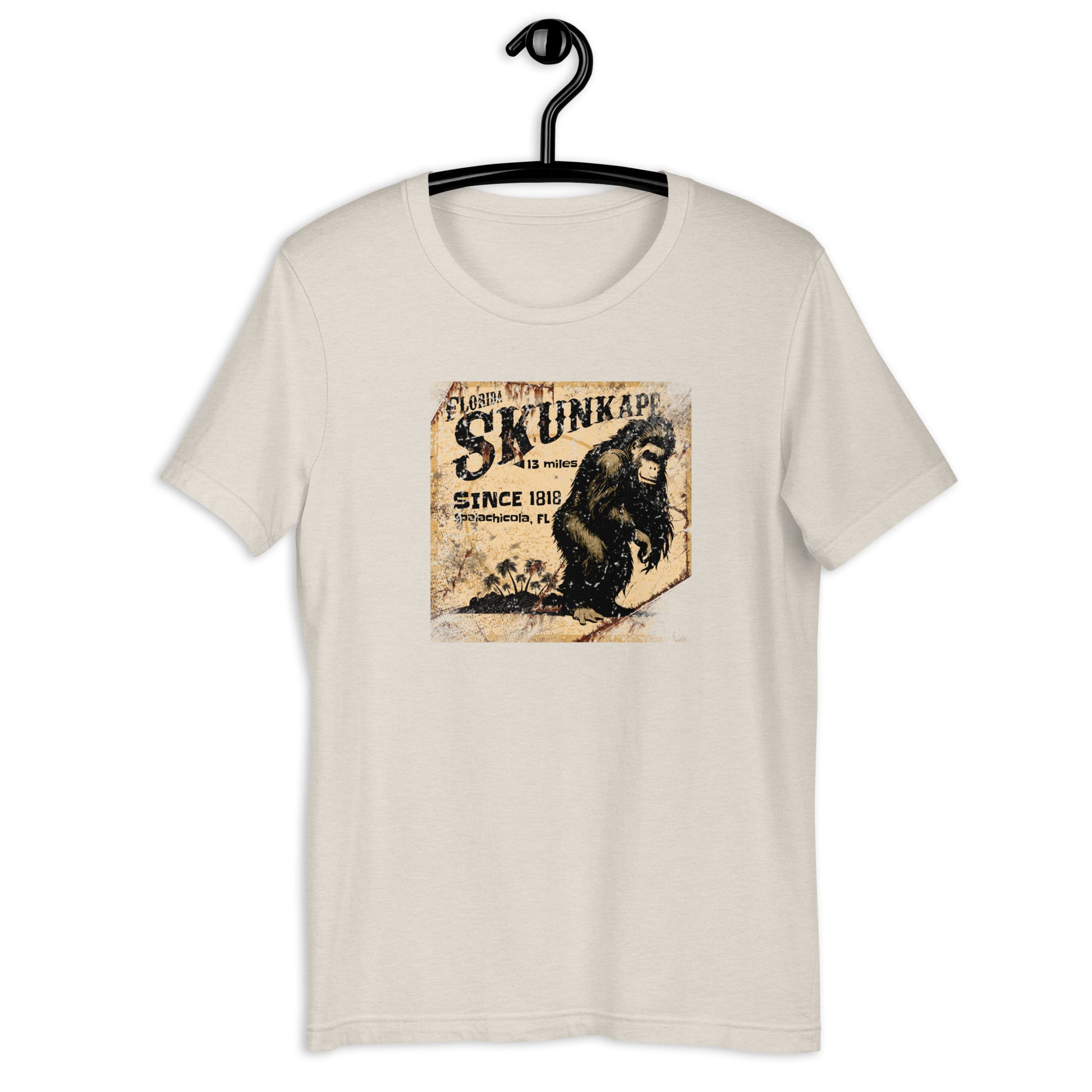 If you're a fan of cryptids and Florida folklore, you'll love the 1818 Skunk Ape cryptid t-shirt. Crafted from the highest-quality materials, this skunk ape t-shirt is both comfortable and durable. Whether you're on the hunt for the elusive creature or just want to show off your love for the legend, this cryptid apparel is the perfect choice. Invest in a piece of Florida history and order your t-shirt today!