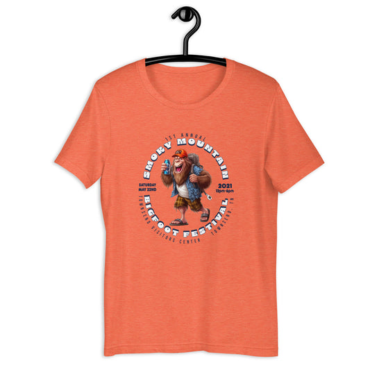"Get your hands on our exclusive Smoky Mountain Bigfoot Festival 2021 t-shirt! Featuring a cool cryptid design, this bigfoot t-shirt is perfect for any bigfoot enthusiast. Show off your love for the infamous creature with our limited edition bigfoot clothing. Shop now and add this must-have bigfoot apparel to your collection!"