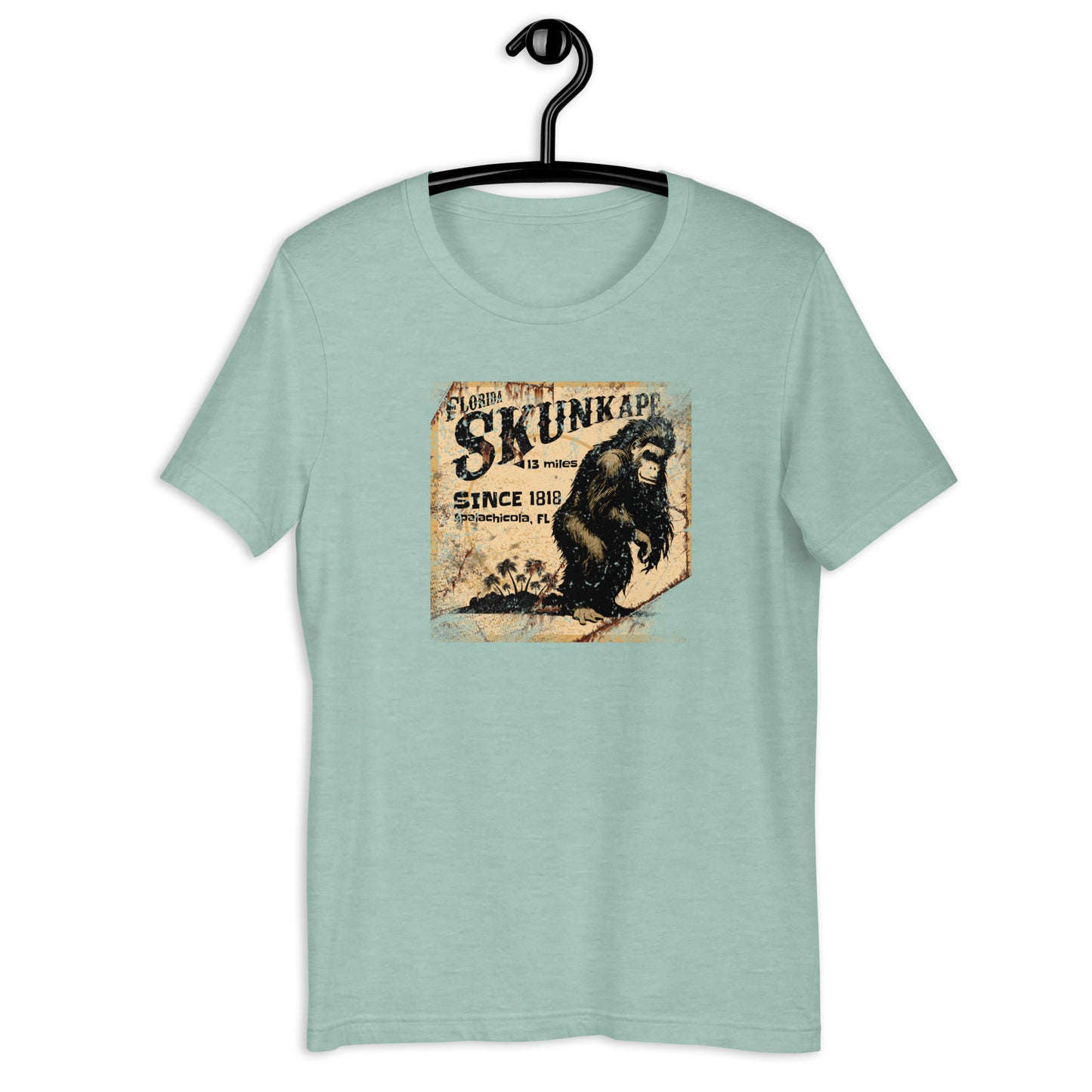 If you're a fan of cryptids and Florida folklore, you'll love the 1818 Skunk Ape cryptid t-shirt. Crafted from the highest-quality materials, this skunk ape t-shirt is both comfortable and durable. Whether you're on the hunt for the elusive creature or just want to show off your love for the legend, this cryptid apparel is the perfect choice. Invest in a piece of Florida history and order your t-shirt today!