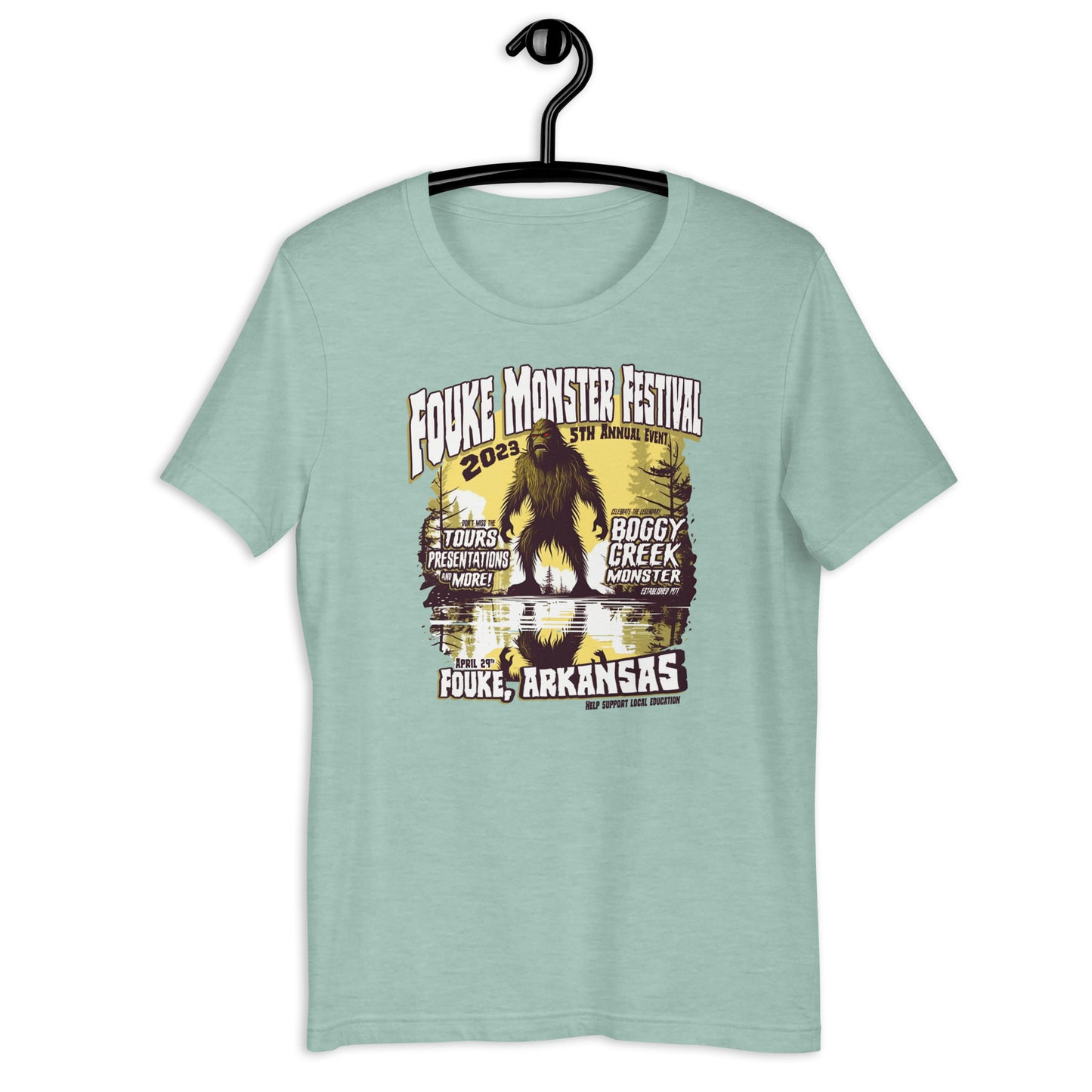 Get your hands on a one-of-a-kind Fouke Monster Festival t-shirt! Our original design t-shirt features the infamous Boggy Creek Monster and is perfect for fans of all things cryptid. Show your love for all things weird with our cryptid clothing and apparel.