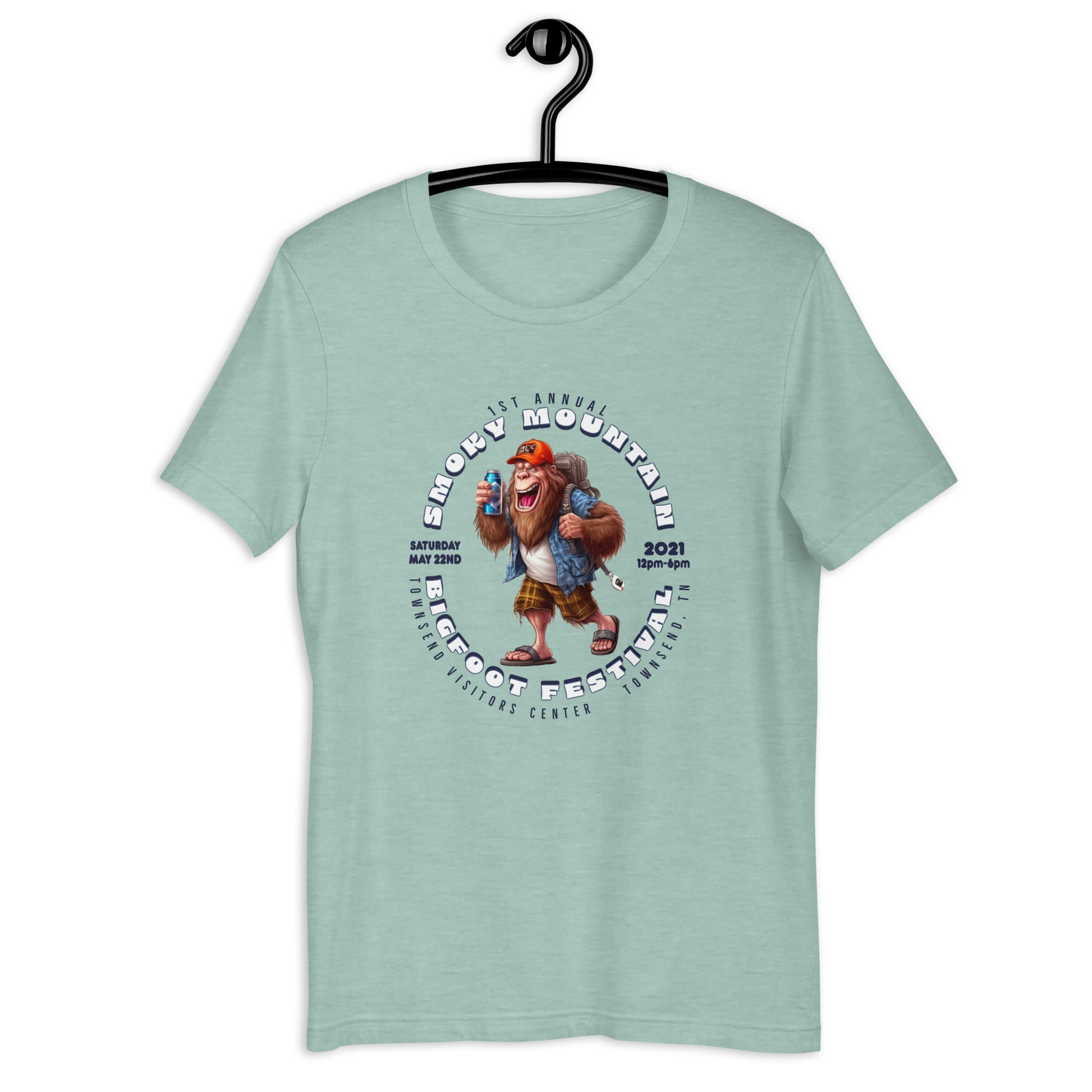 "Get your hands on our exclusive Smoky Mountain Bigfoot Festival 2021 t-shirt! Featuring a cool cryptid design, this bigfoot t-shirt is perfect for any bigfoot enthusiast. Show off your love for the infamous creature with our limited edition bigfoot clothing. Shop now and add this must-have bigfoot apparel to your collection!"