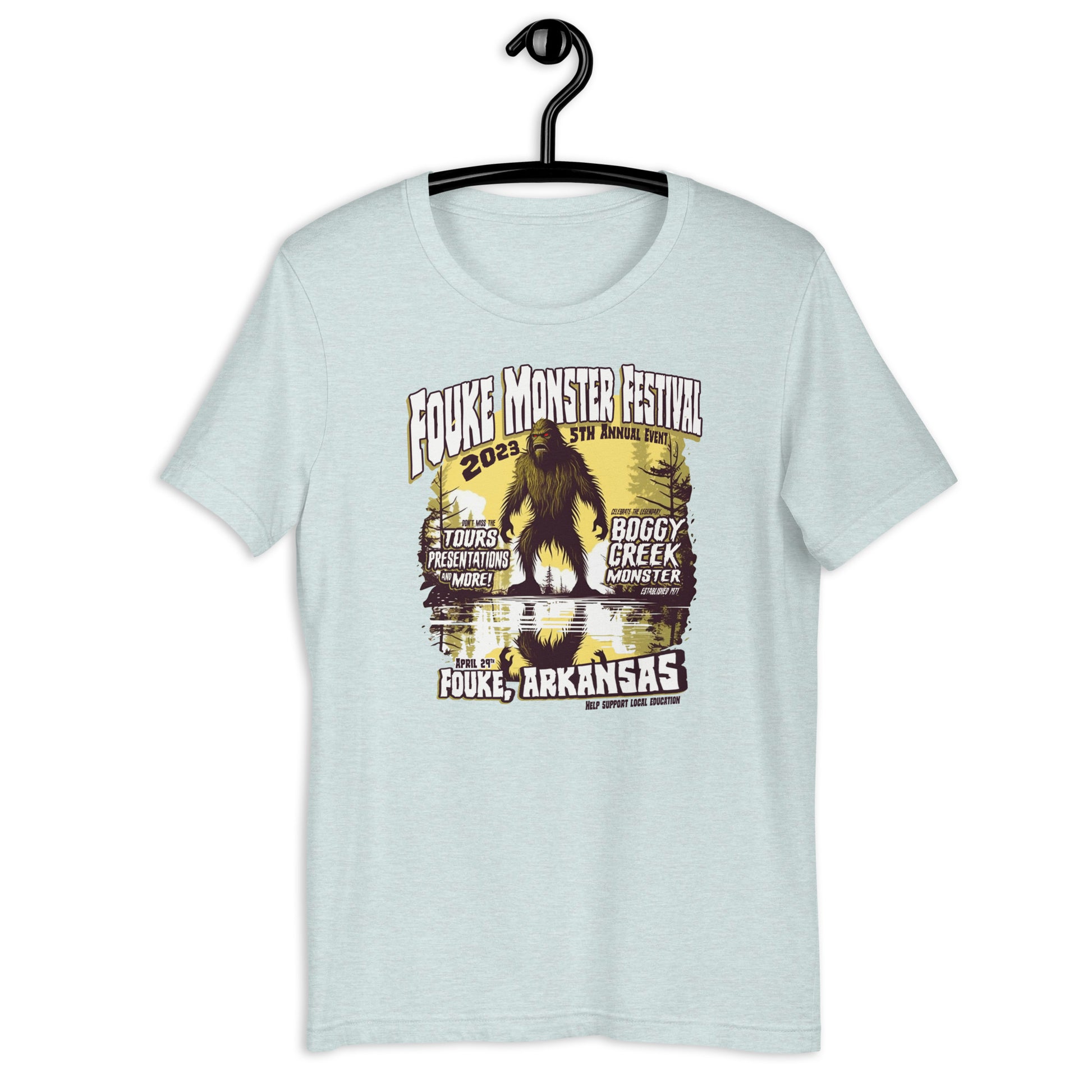 Get your hands on a one-of-a-kind Fouke Monster Festival t-shirt! Our original design t-shirt features the infamous Boggy Creek Monster and is perfect for fans of all things cryptid. Show your love for all things weird with our cryptid clothing and apparel.