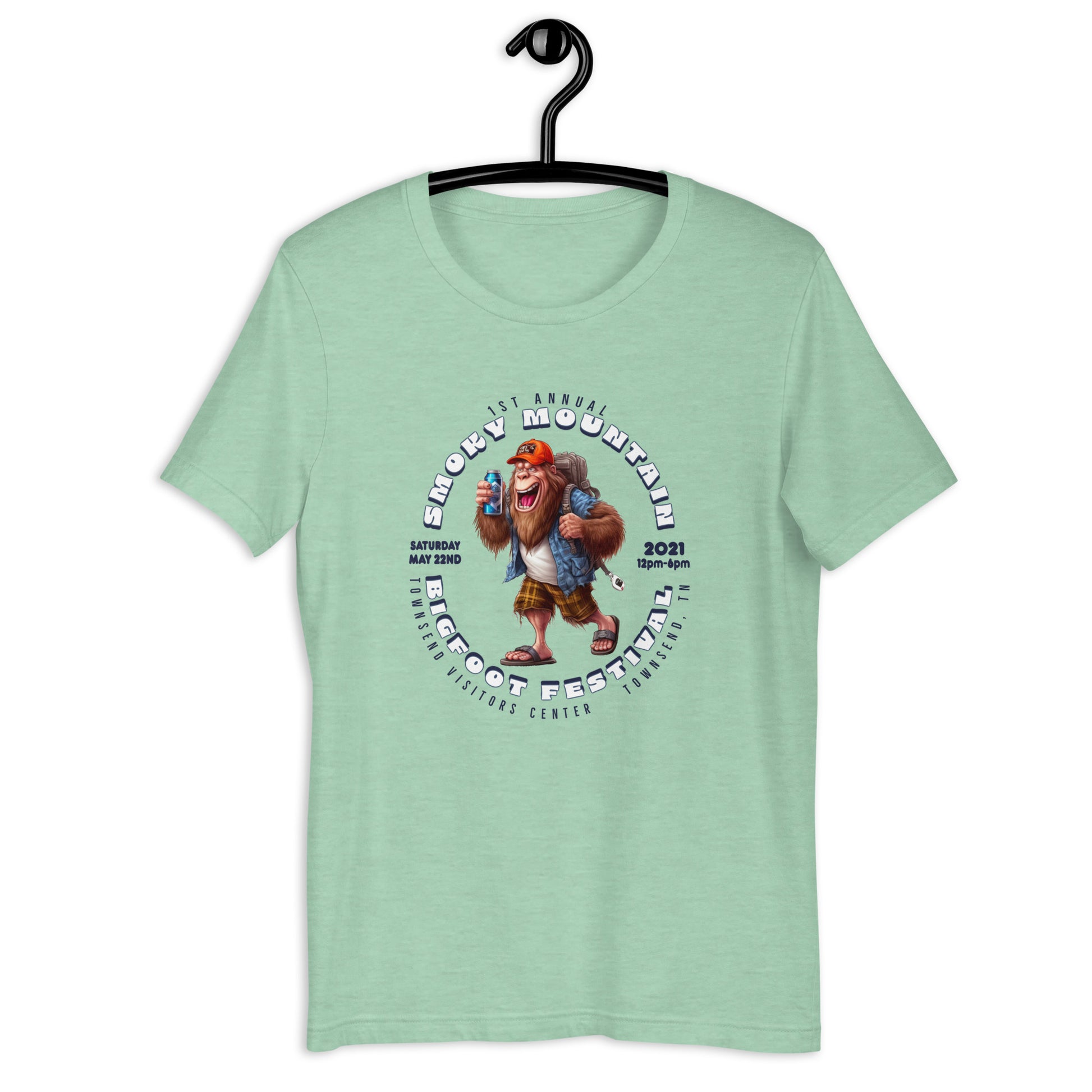 "Get your hands on our exclusive Smoky Mountain Bigfoot Festival 2021 t-shirt! Featuring a cool cryptid design, this bigfoot t-shirt is perfect for any bigfoot enthusiast. Show off your love for the infamous creature with our limited edition bigfoot clothing. Shop now and add this must-have bigfoot apparel to your collection!"