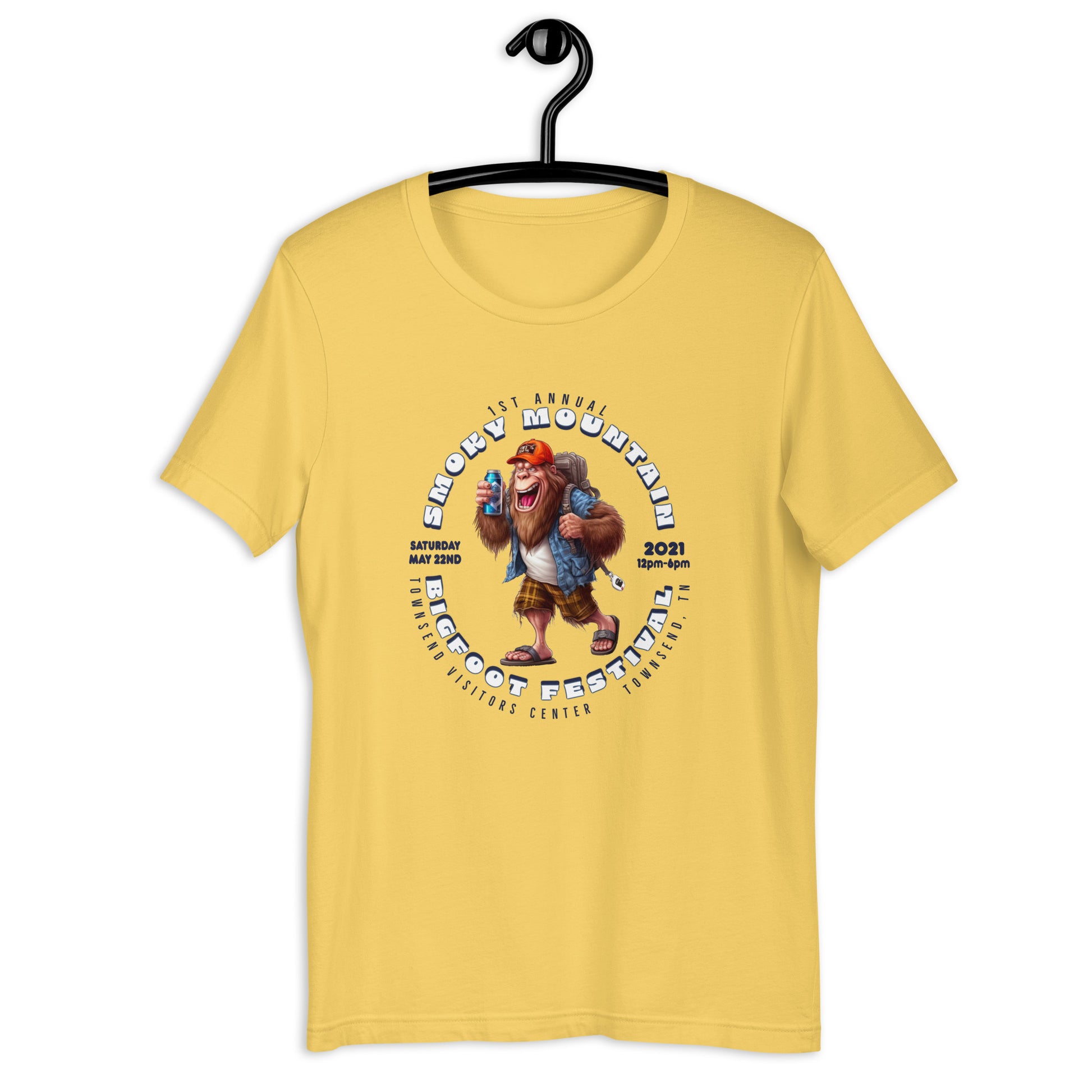 "Get your hands on our exclusive Smoky Mountain Bigfoot Festival 2021 t-shirt! Featuring a cool cryptid design, this bigfoot t-shirt is perfect for any bigfoot enthusiast. Show off your love for the infamous creature with our limited edition bigfoot clothing. Shop now and add this must-have bigfoot apparel to your collection!"